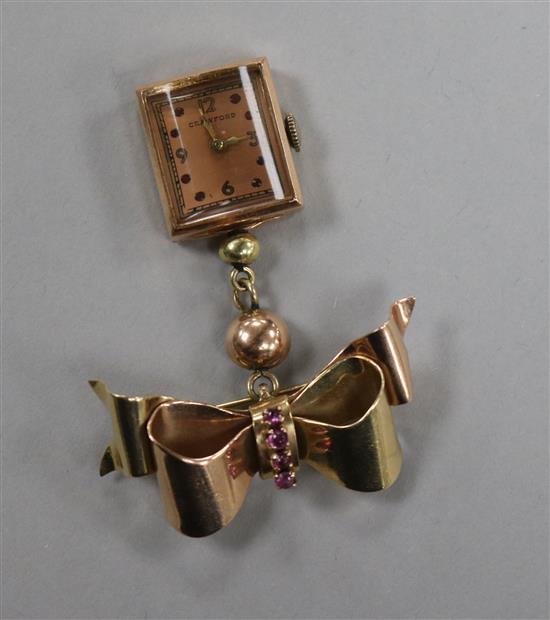 A 1950s 14ct gold and gem set Crawford lapel watch, with 14ct gold and gem set ribbon bow brooch, 55mm.